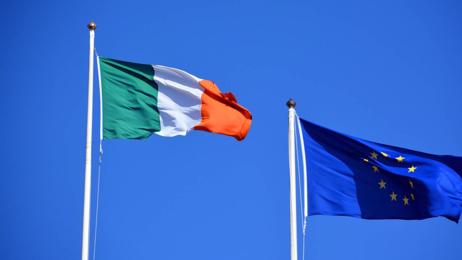 Flag of Europe, Against the blue sky of the Western world, the stars symbolise the peoples of Europe in a form of a circle, a sign of union and The national flag of Ireland